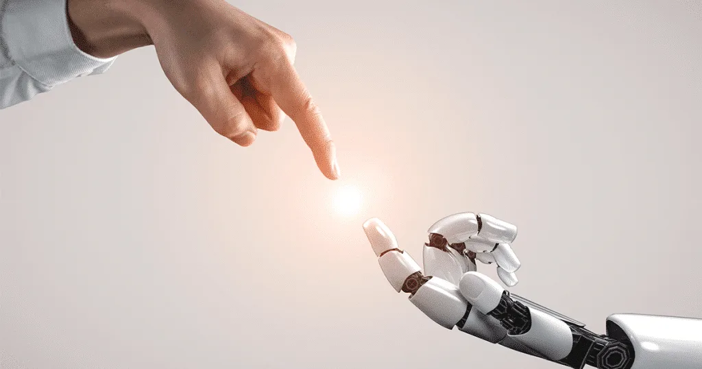 Robot and human hands almost touching and showing AI's impact on recruiters.