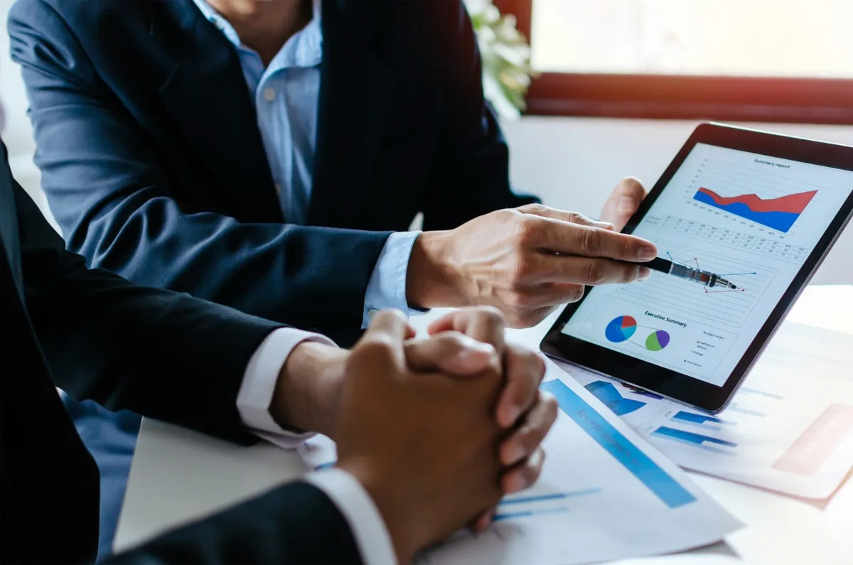 Recruiter examining HR technology trends, analyzing data and tools for improved hiring practices.