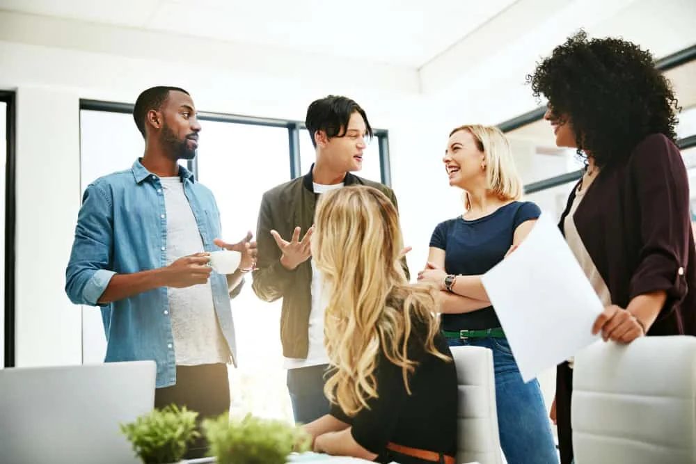 A diverse team of recruiters designing a DEI framework