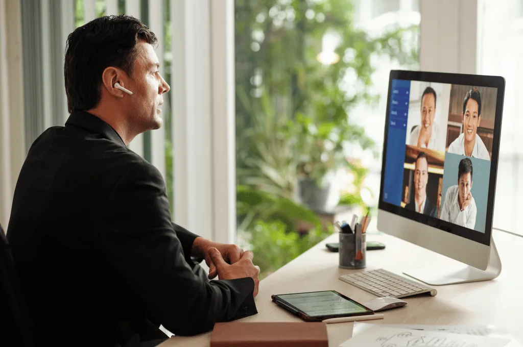 A person speaking with other people via video chat