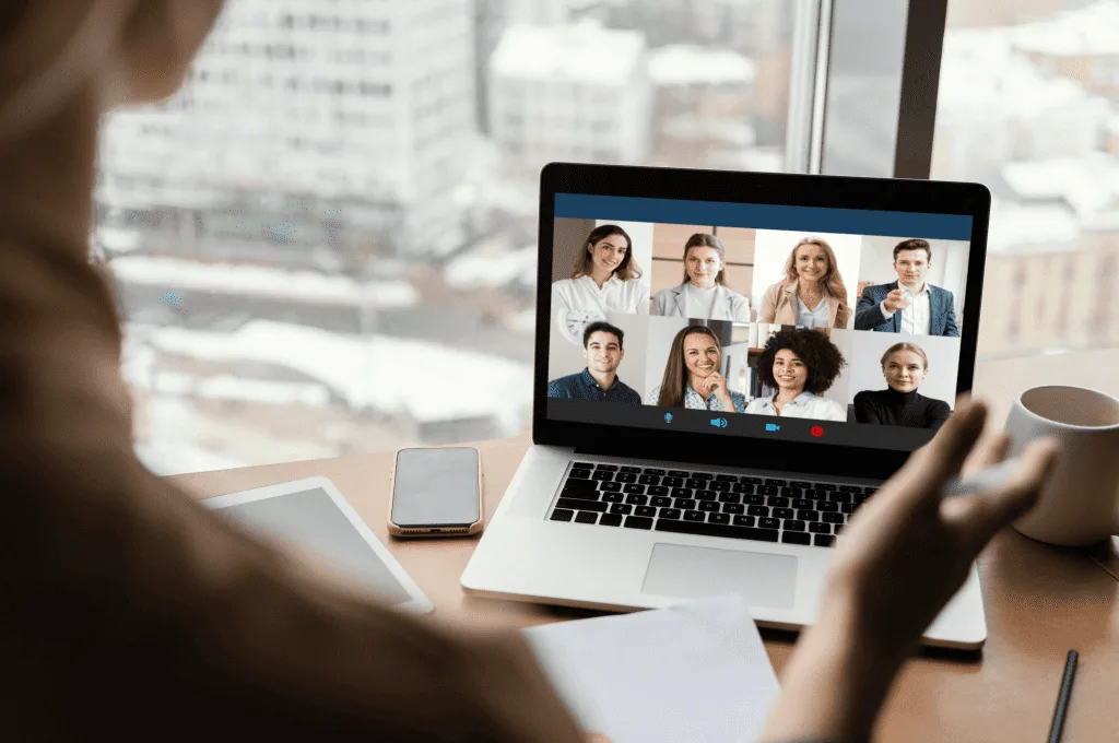 Back view of a woman having video call at work