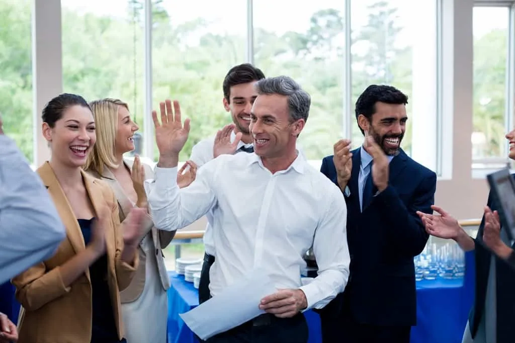 Employee being congratulated for more effective recruitment marketing