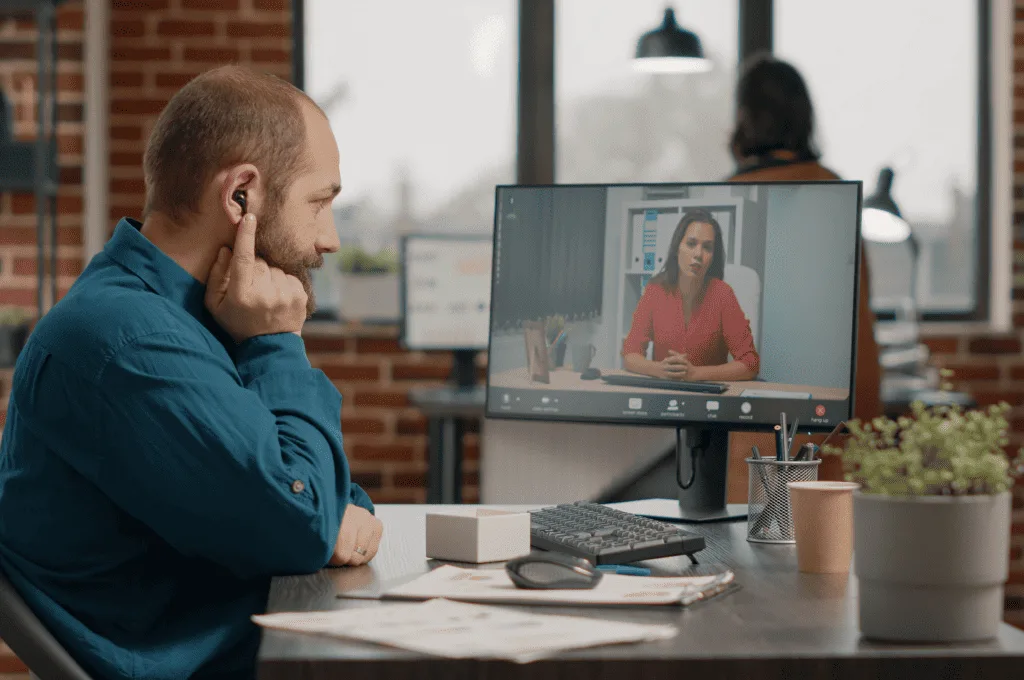 
Individual talking with a woman during a video call