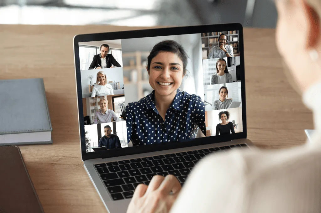 Laptop screen woman shoulder view on a videoconference