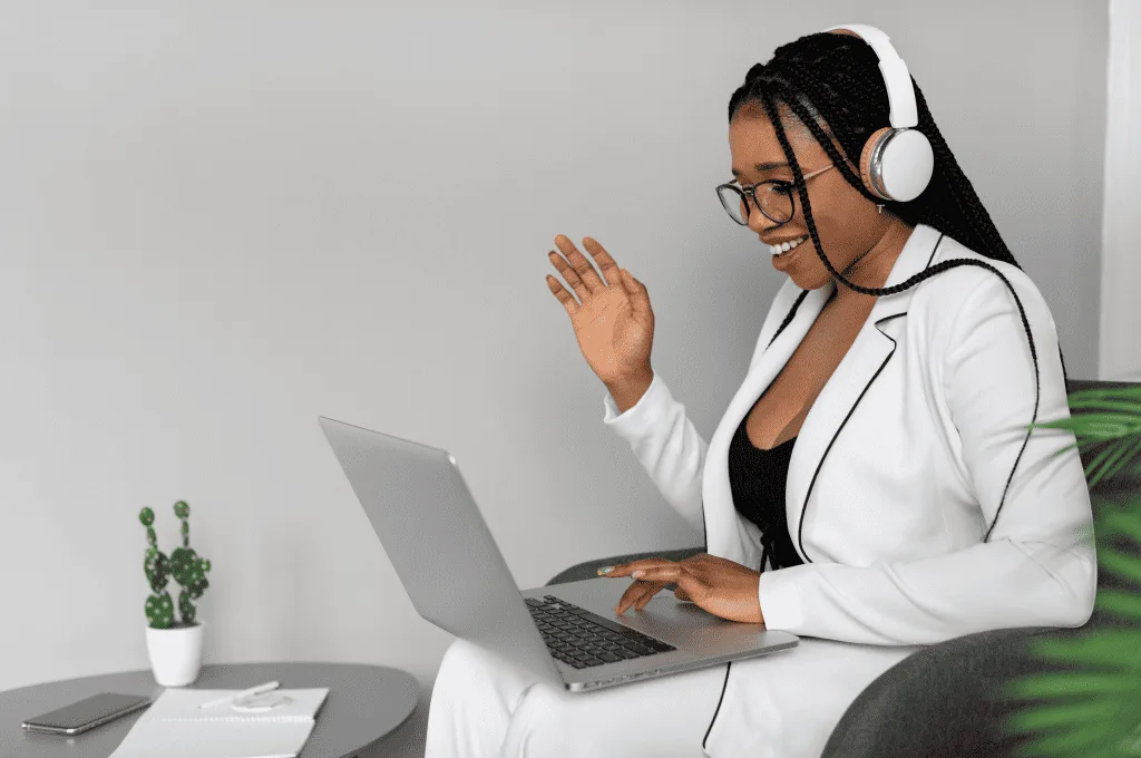 Medium shot of a woman holding laptop