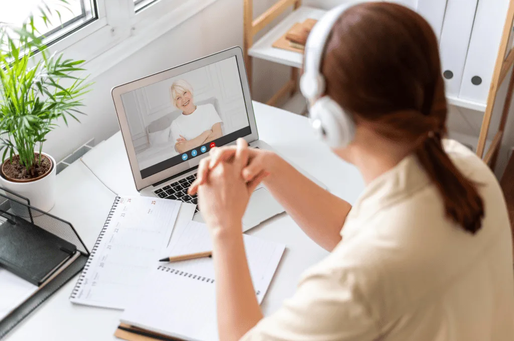 Side view of a woman making video call