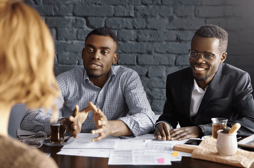 Two recuriters trying to conduct an interview with other person