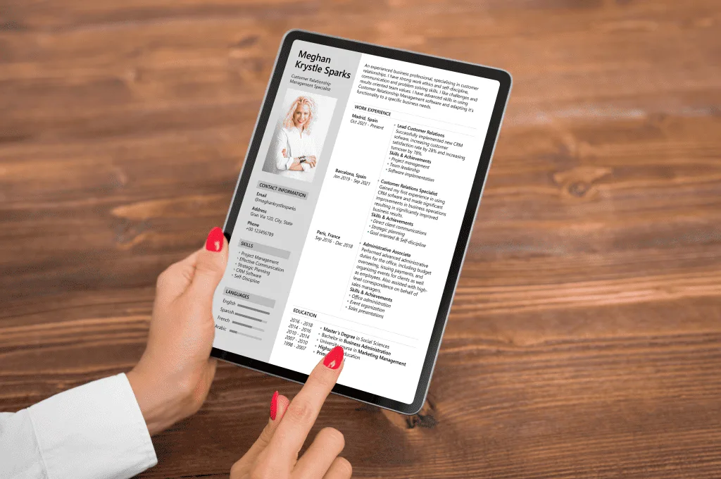Woman looking at a CV document on a tablet