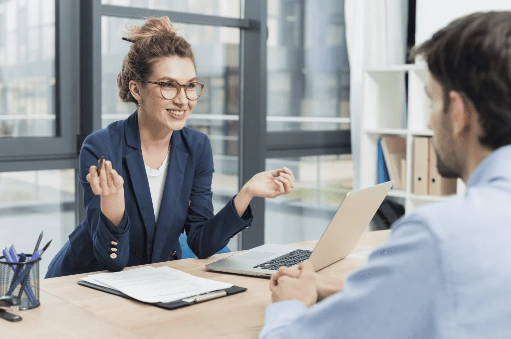 Woman smiling while talking to another person