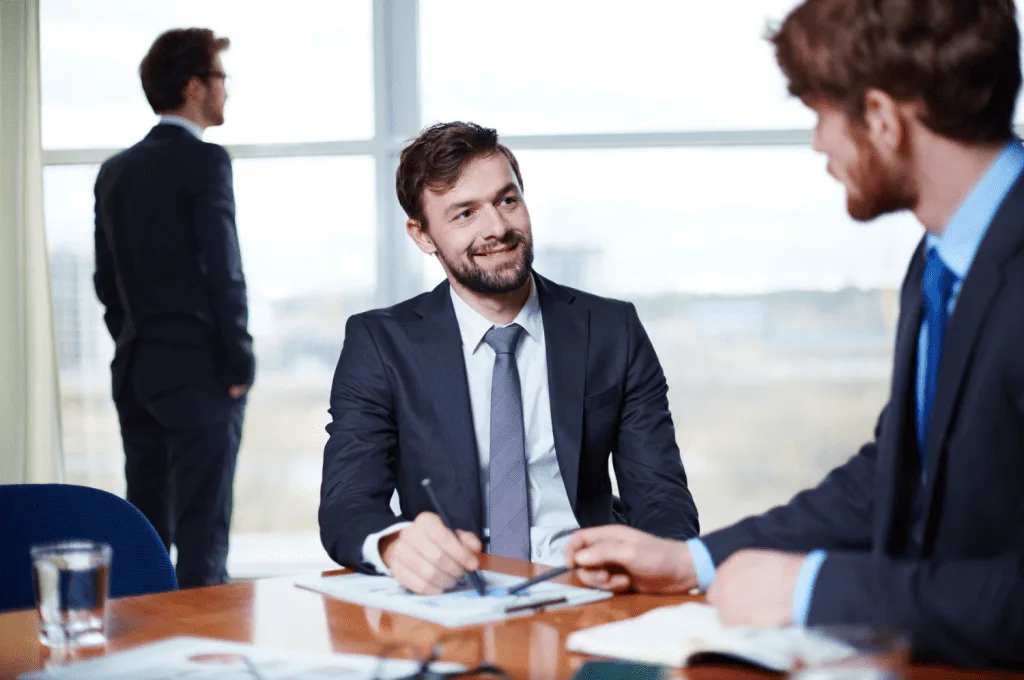 HR managers discussing stages of the hiring process.